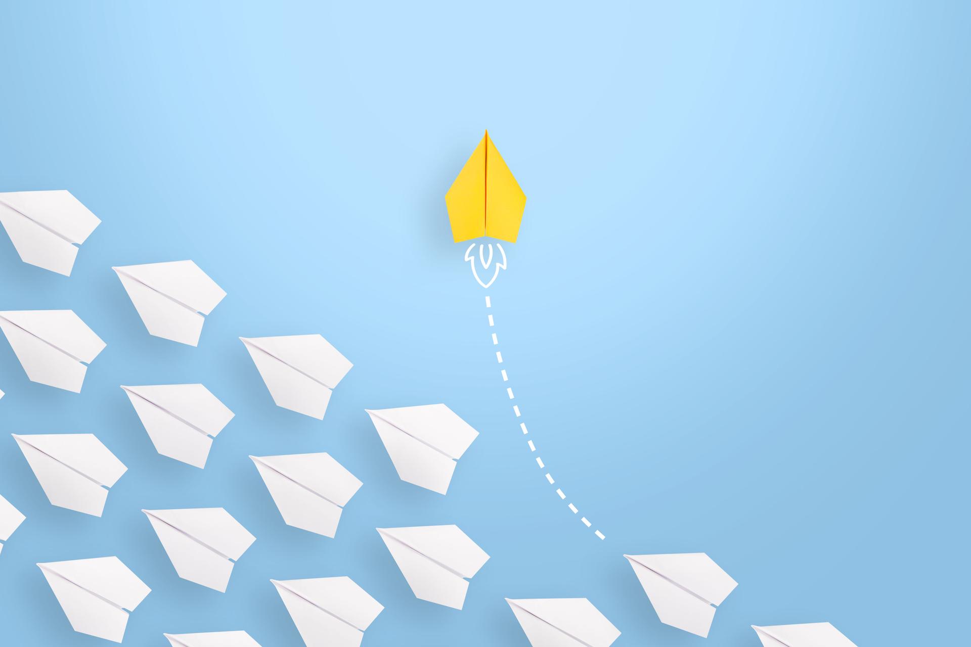 Change concepts with red paper airplane leading among white