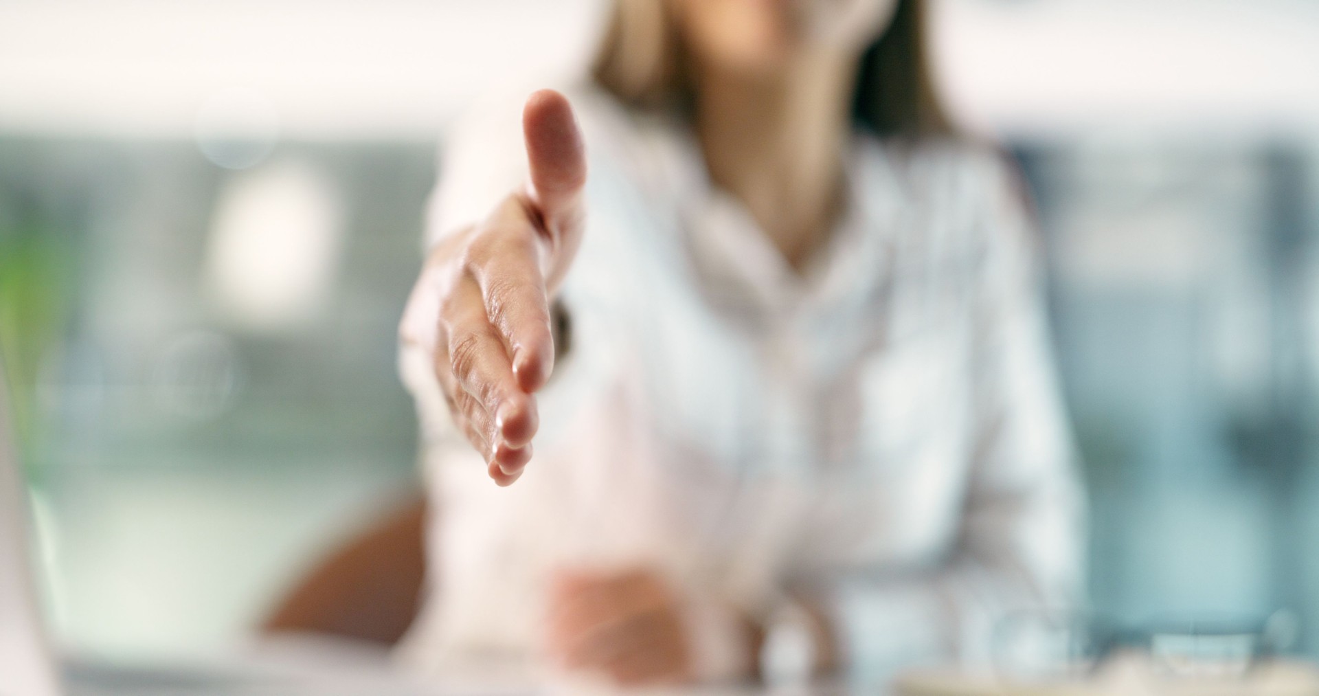Woman, doctor and handshake in meeting, partnership or agreement in deal, greeting or introduction at hospital. Closeup of female person, medical or healthcare professional shaking hands in hiring